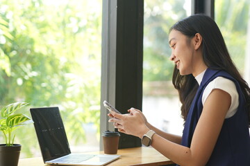 Asian woman succeeds at office