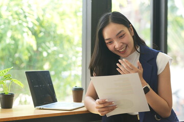 Asian woman succeeds at office