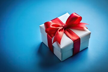 Obraz premium gift box with red ribbon bow on blue background