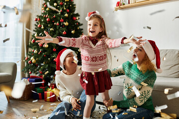 A delightful family enjoys a festive moment at home, celebrating together with laughter and joy.