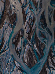 View from above, stunning patterns created in the volcanic sands of Iceland. As glaciers melt the water flows as rivers out to sea. Natural pattern, background, wallpaper.