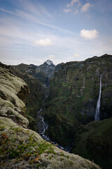 View from above, stunning aerial view of a dramatic landscape with a beautiful waterfall, Hangandifoss, Iceland.