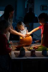 Family Halloween pumpking carving moment