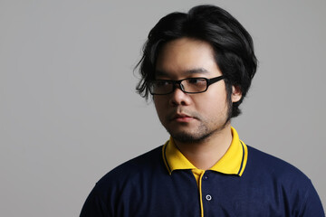 close up portrait of a cool Asian man with flat expression
