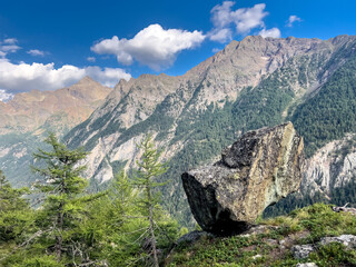 big rock balance represent delicate equilibrium nature. Mountain background.
