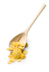 Wooden spoon and corn flakes isolated on grey