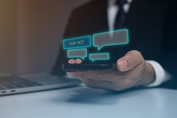 A man is holding a cell phone with a chatbot on the screen