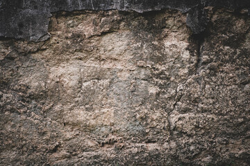 Empty brown rough stone wall on cave for abstract  background and texture. beautiful patterns, space for work, banner, wallpaper close up.