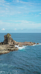 top view of watu lumbung beach, indonesia. blue transparant sea and rock. travel photo