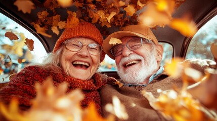 A joyful elderly couple wearing glasses and cozy sweaters laugh together in a car filled with autumn leaves, capturing the essence of happiness and companionship.