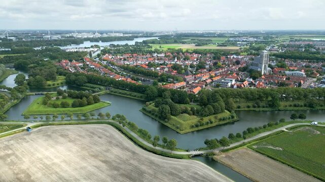 over fortified town brielle beautiful green parks historic 17th century church views town's fortifications aerial panning view netherlands heritage site parkland dutch 