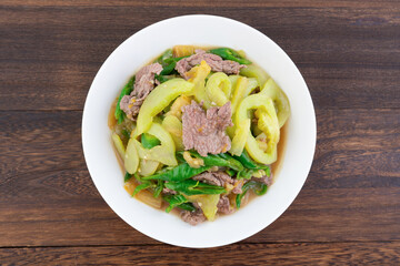 A dish of home-cooked green tomato beef