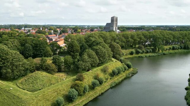 revealing brielle&rsquo;s 17th century church surrounding fortifications historical architecture dutch town upward aerial netherlands fortified motion view 