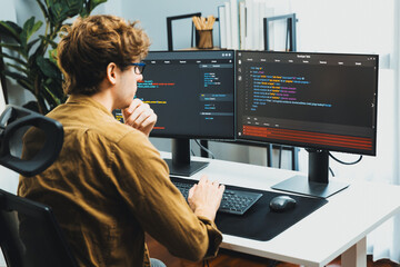 Working IT developer with stressful overworked in creating online software development coding on pc...