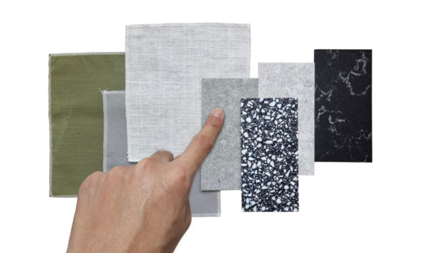 interior architect chooses material samples for modern luxury decoration style contains palette of curtain fabric draperies and artificial stones or quartz isolated on background with clipping path.