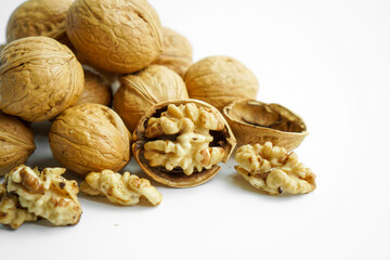 Ripe dry split walnut. Walnuts Isolated on White Background. closeup of shelled organic walnut halves. walnut, nut, full depth of field