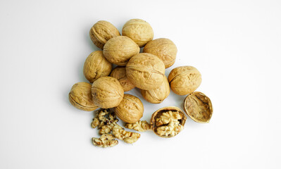 Ripe dry split walnut. Walnuts Isolated on White Background. closeup of shelled organic walnut halves. walnut, nut, full depth of field