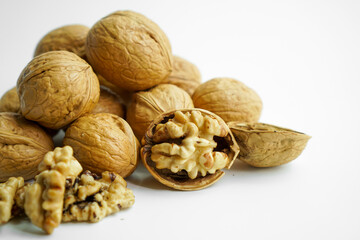 Ripe dry split walnut. Walnuts Isolated on White Background. closeup of shelled organic walnut halves. walnut, nut, full depth of field
