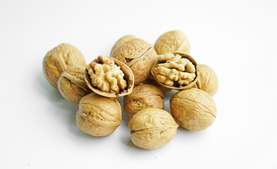 Ripe dry split walnut. Walnuts Isolated on White Background. closeup of shelled organic walnut halves. walnut, nut, full depth of field