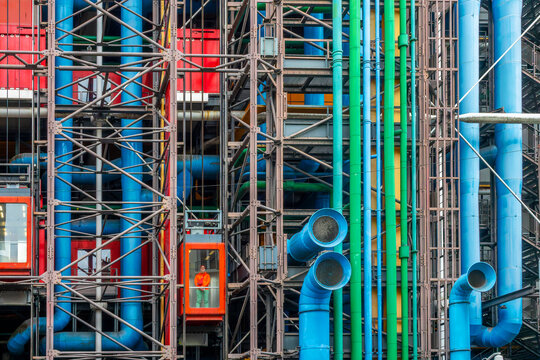 Colorful elevator and pipes at Centre Pompidou (or Beaubourg), inside-out modern architecture by Renzo Piano and Richard Rogers in Paris France
