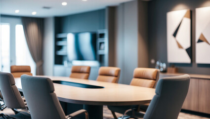 A blurred image of a stylish conference room with a large table, comfortable chairs, and contemporary decor, suggesting a professional environment.