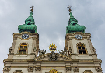 Baroque Twin Clock Towered Saint Anna Church in Buda Along Danube River in Budapest, Hungary.