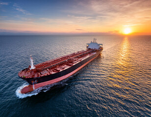  Aerial view of a large crude oil tanker traveling over calm sea during sunset 527