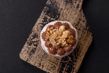 Sweet puff tart with meringue, cream and nuts