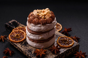 Sweet puff tart with meringue, cream and nuts