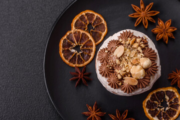 Sweet puff tart with meringue, cream and nuts