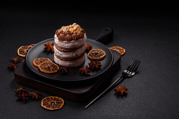 Sweet puff tart with meringue, cream and nuts
