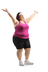 Overweight young woman in sportswear raising arms