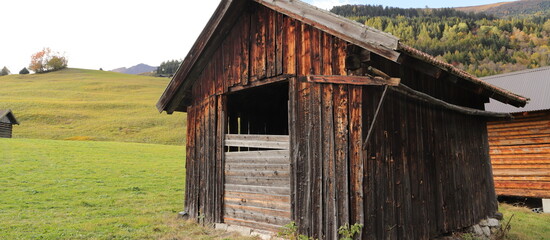 an old little crooked hut in the alps