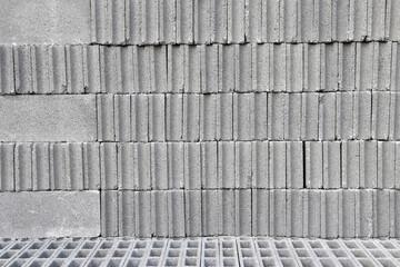 stack of grey concrete block, cement blocks stored in material warehouse