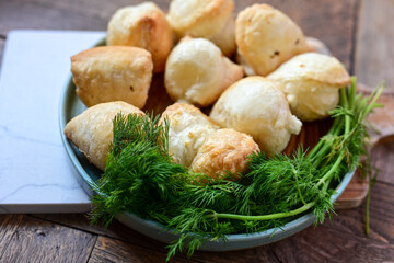 Fresh baked home made  Mini cheese puff pastries.Cheese pie with phyllo pastry and herbs