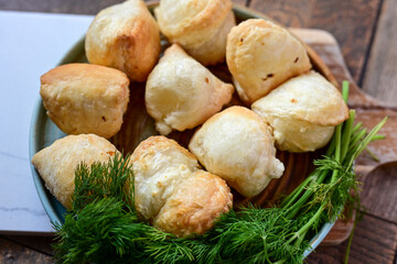 Fresh baked home made  Mini cheese puff pastries.Cheese pie with phyllo pastry and herbs