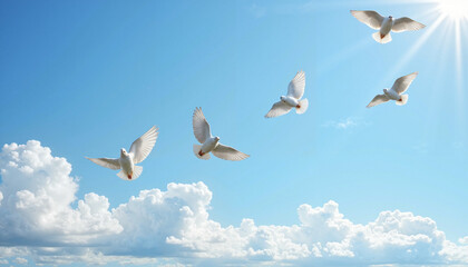 Obraz premium Group of white doves flying in a blue sky with clouds and sunlight 