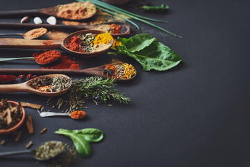 Kitchen, spices and powder on table for culinary ingredients, flavor and mockup space with leaves for cooking. Seeds, curry and above counter with meal prep, herbs and variety for food at restaurant