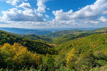 Obraz premium Breathtaking view of rolling hills with vibrant autumn foliage under a brilliant blue sky