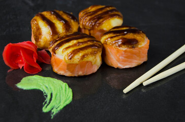 Baked sushi roll with cheese top.