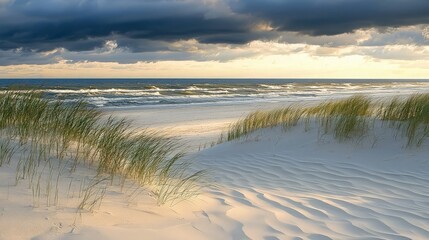 A view of the ocean from the dunes with a dramatic sky.