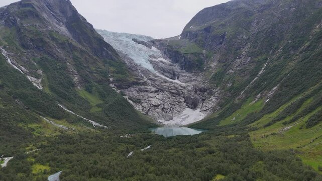 Aerial Briksdalsbreen Glacier in Norway, Briksdal, Scandinavia with thick ice. Epic mountain nature.