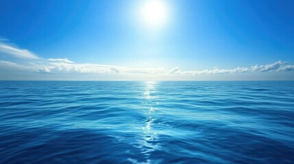 Obraz premium Deep blue ocean water with subtle ripples reflecting the sunlight, extending towards the horizon.