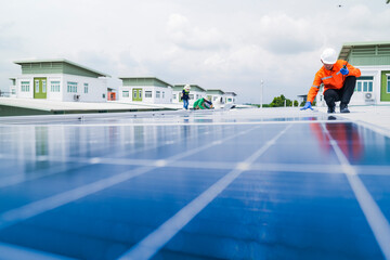 engineer man inspects construction of solar cell panel or photovoltaic cell by electronic device....