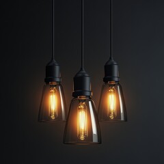 Three elegant pendant lights with warm glowing bulbs against a dark background, creating a cozy atmosphere.