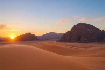 Fototapeta premium Golden sunrise over the tranquil desert dunes and majestic mountains in Wadi Rum