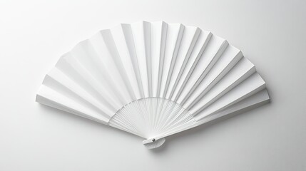 Flat lay of a white folding fan mockup with pleats fully extended, isolated on a bright white surface.