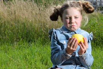 A sour lemon and a girl of six.