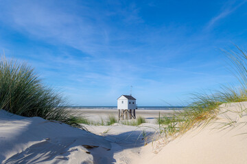 A wooden shelter on high stilts that stands on the North Sea beach (De Drenkelingenhuisje) The Dutch Wadden Sea island Terschelling, Municipality and an island in the northern, Friesland, Netherlands.