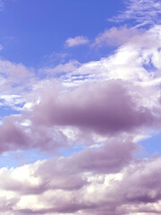 Fluffy White Clouds in a Blue Sky as A Skyscape Background